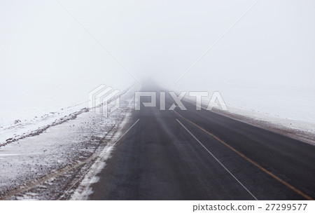 Snowstorm and poor visibility on the road, end is 27299577