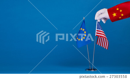 Two flags and hand on a blue background, 27303558