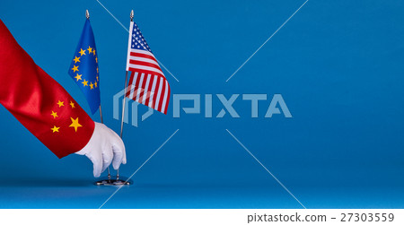 Two flags and hand on a blue background, Two flags and hand on a blue background, 27303559