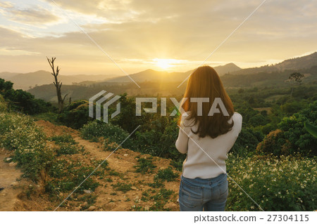 woman hiker taking photo at mountain woman hiker taking photo at mountain 27304115
