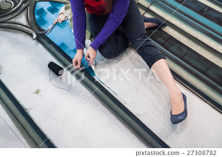 the woman creates theatrical sceneries for the 27308782