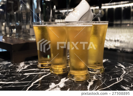 Glass of beer served on the counter in a party 27308895