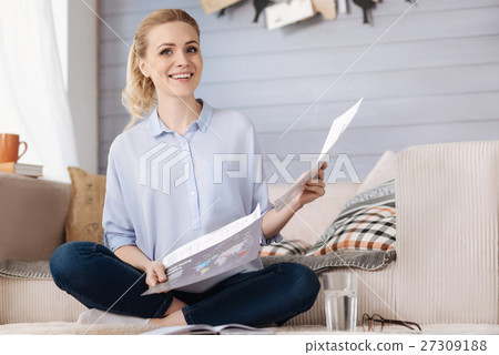 Happy pregnant woman holding documents 27309188
