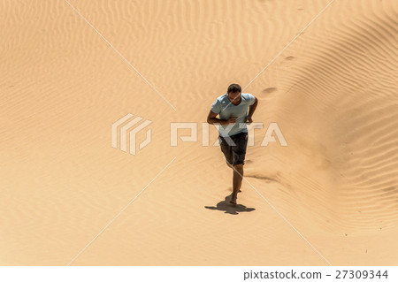 Man tourist desert rub al khali Oman running sand  27309344