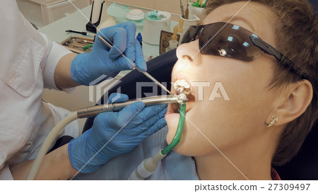 Woman at the dentist medical clinic for treatment Woman at the dentist medical clinic for treatment 27309497