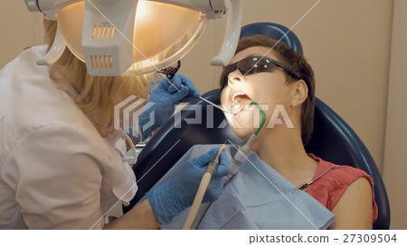 Woman at the dentist medical clinic office Woman at the dentist medical clinic office 27309504