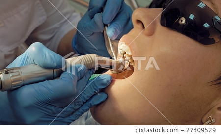 Woman at the dentist medical clinic for treatment Woman at the dentist medical clinic for treatment 27309529