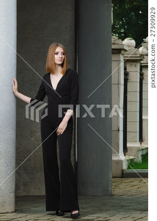 Red hair fashion model in black overall posing 27309929