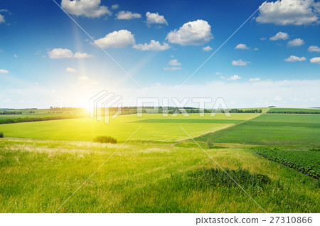 hilly terrain, field and sunrise on blue sky hilly terrain, field and sunrise on blue sky 27310866