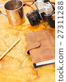 notebook, camera on the background of vintage map 27311288