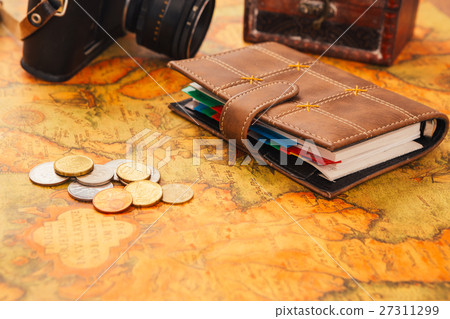 notebook, camera on the background of vintage map 27311299