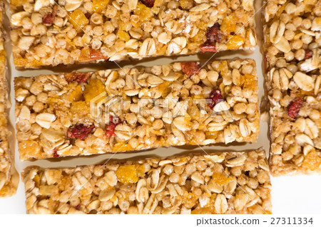 muesli bars with  dried fruit isolated background 27311334
