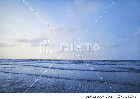 View of beach and waves at sunrise 27313258