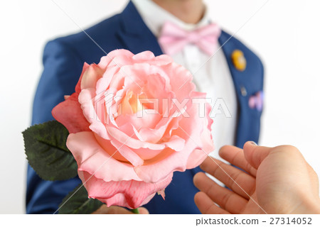 man in blue suit carry flowers 27314052