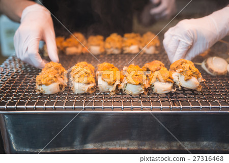 Scallop and sea eggs skewer grill 27316468