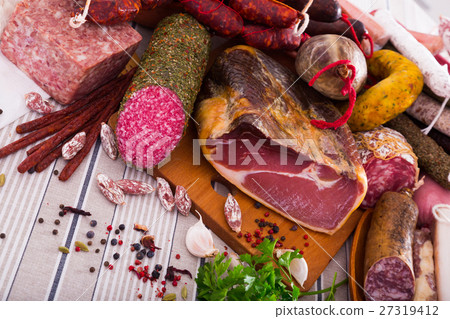 Variety of meats on table Variety of meats on table 27319412