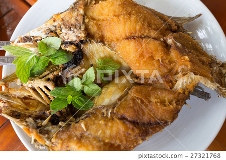 Deep fried snapper topped with sweet fish sauce Deep fried snapper topped with sweet fish sauce 27321768