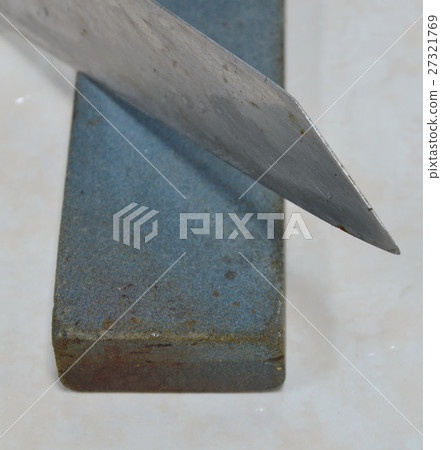 kitchen knife blade on whetstone kitchen knife blade on whetstone 27321769