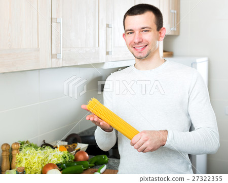 Portrait of smiling male with spaghetti 27322355