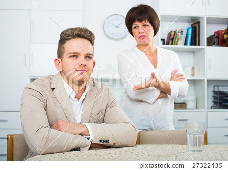 Mother calms the son 27322435