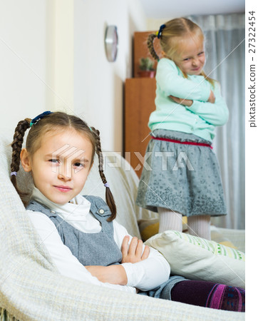 Offended girls sitting apart at home. 27322454