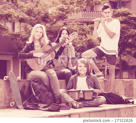 Happy girls and boys with musical instruments Happy girls and boys with musical instruments 27322826