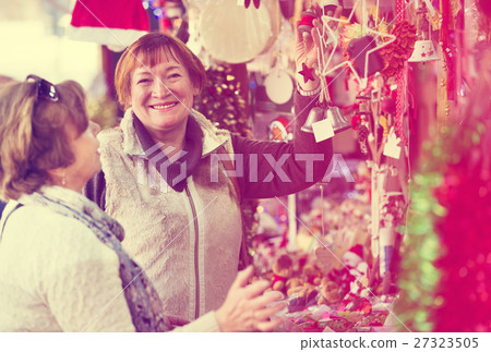 Female pensioners buying X-mas decorations Female pensioners buying X-mas decorations 27323505