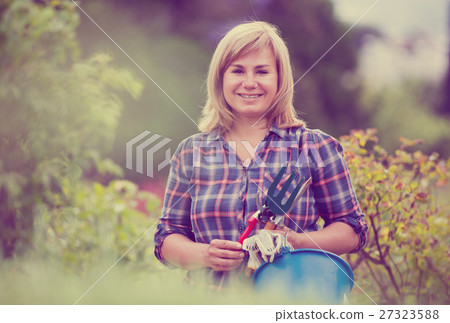 woman bucket garden woman bucket garden 27323588