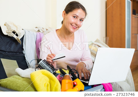 brunette packing luggage brunette packing luggage 27323746