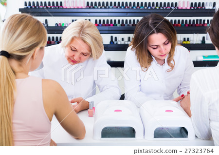 women doing manicure 27323764