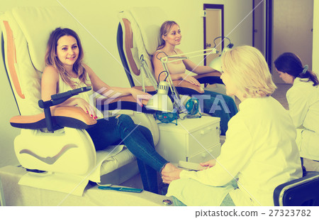 Female clients doing toenails Female clients doing toenails 27323782
