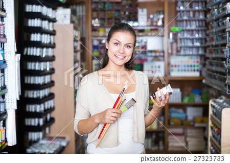 Woman holding supplies for painting 27323783