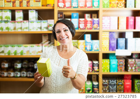 Cheerful mature woman in store Cheerful mature woman in store 27323785