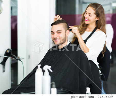 Hairdresser doing hairstyle Hairdresser doing hairstyle 27323786