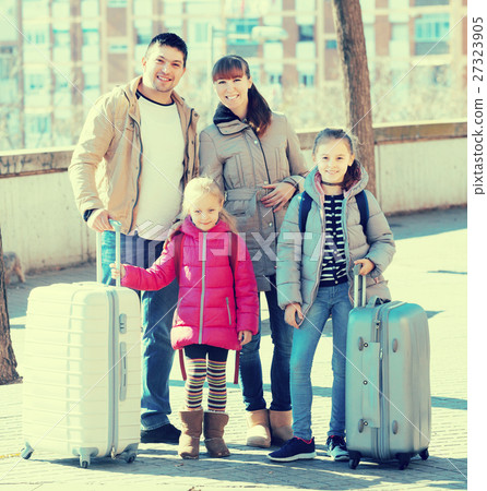 Family with suitcases in journey 27323905