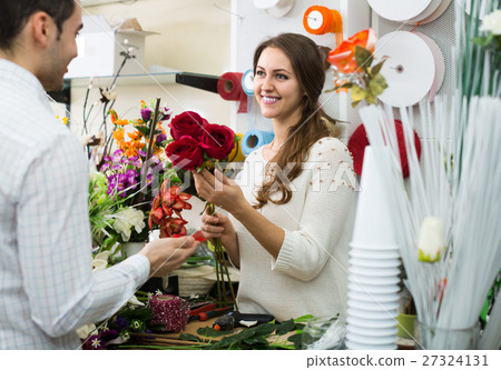 woman seller offering flowers man 27324131