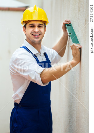 builder posing with spirit level builder posing with spirit level 27324161