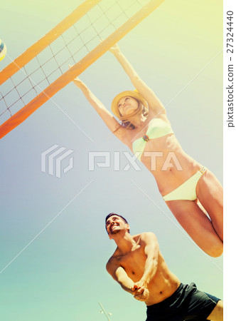 Family having fun on the shore 27324440