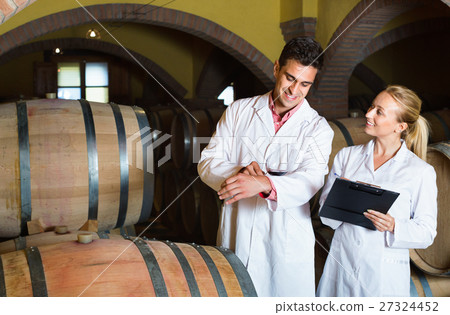 Specialists checking ageing process of wine 27324452
