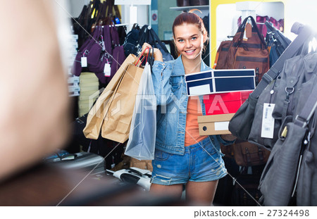 Teenager girl shopping in store with bags Teenager girl shopping in store with bags 27324498