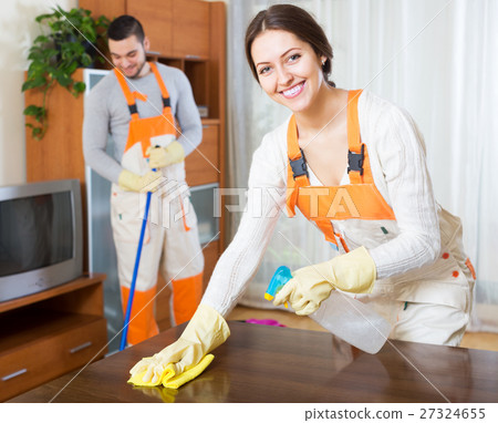 Professional cleaners with equipment clean 27324655