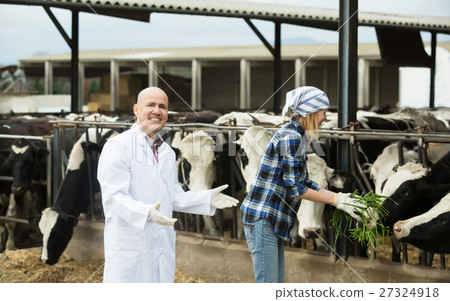 Portrait of smiling cowgirl and doctor Portrait of smiling cowgirl and doctor 27324918
