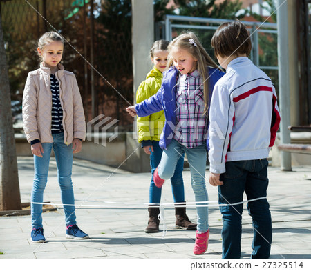 Happy girl jumping with skipping rope Happy girl jumping with skipping rope 27325514