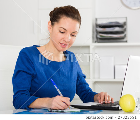 Woman working productively Woman working productively 27325551