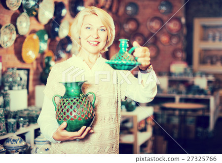 Woman posing with ceramic tableware Woman posing with ceramic tableware 27325766
