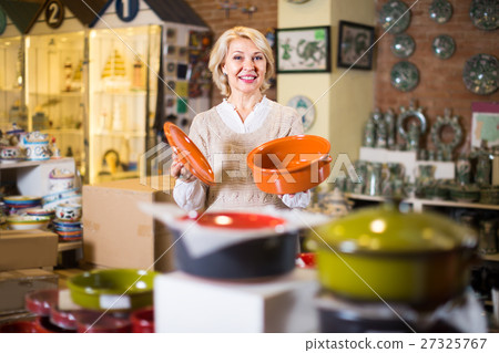 woman buying ceramic ware woman buying ceramic ware 27325767