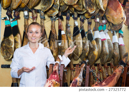 Portrait of glad female selling prosciutto meat 27325772