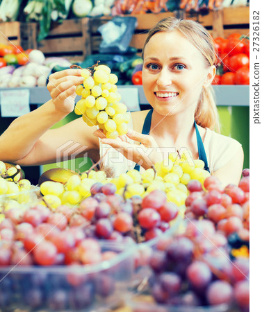 woman selling grapes at market . woman selling grapes at market . 27326182