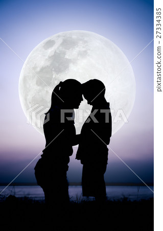 Silhouette side view of mother and child enjoying Silhouette side view of mother and child enjoying 27334385