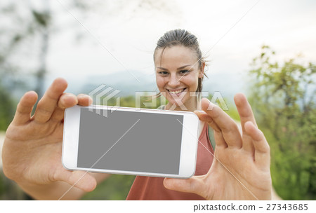 Girl Taking Selfie Outdoors Concept 27343685